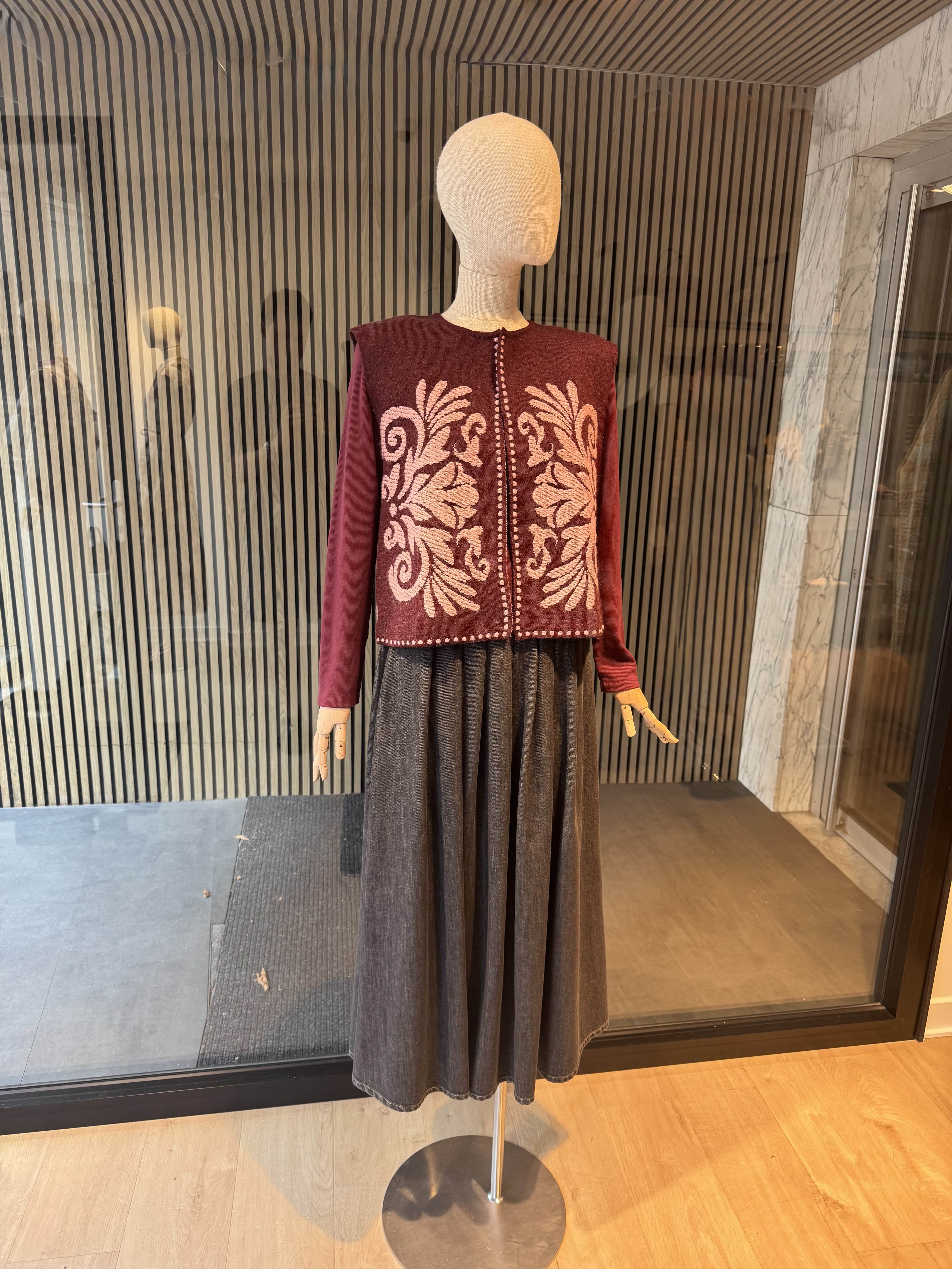 Vest with ornament