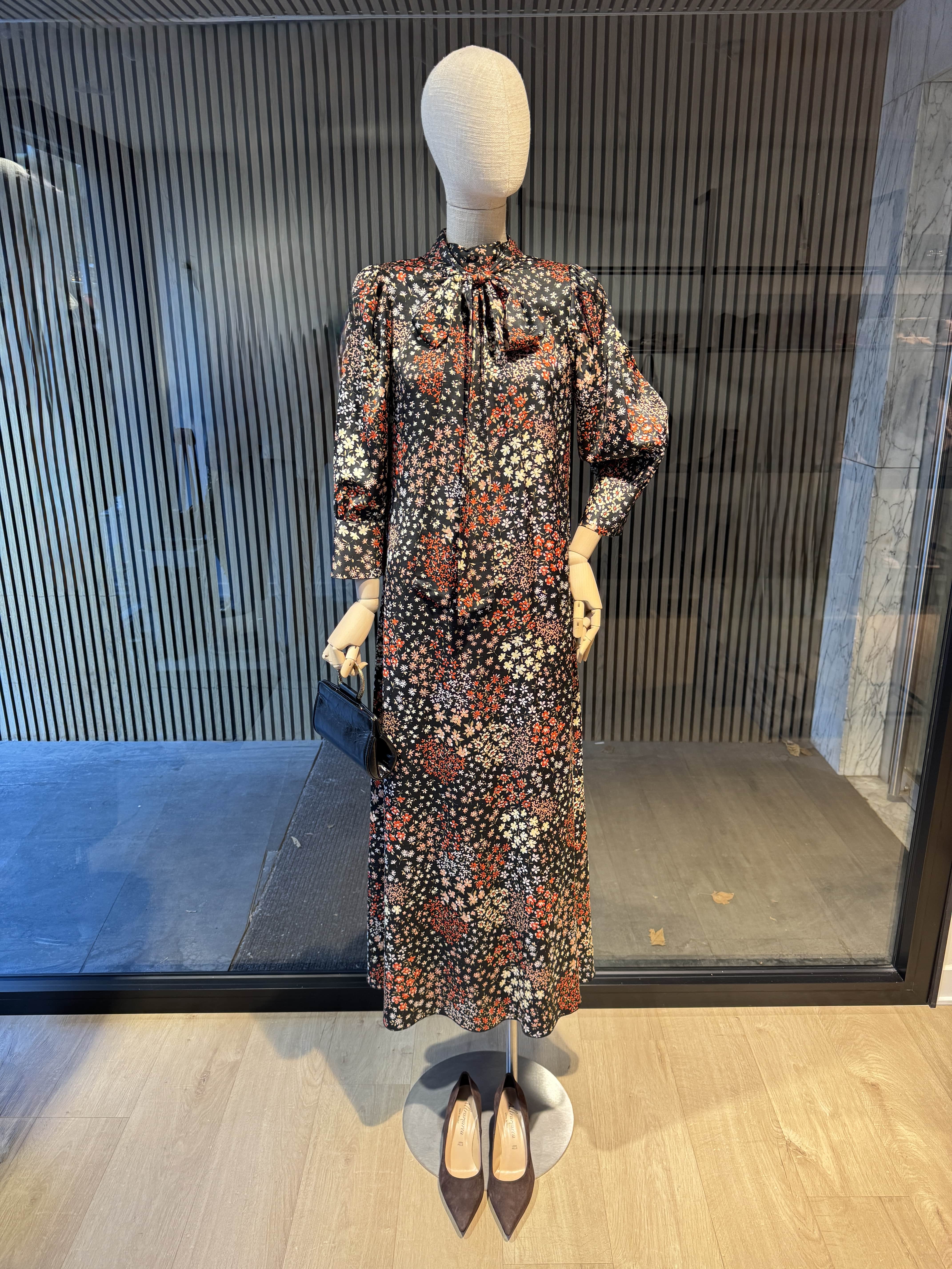 Long relaxed fit black dress with a floral print