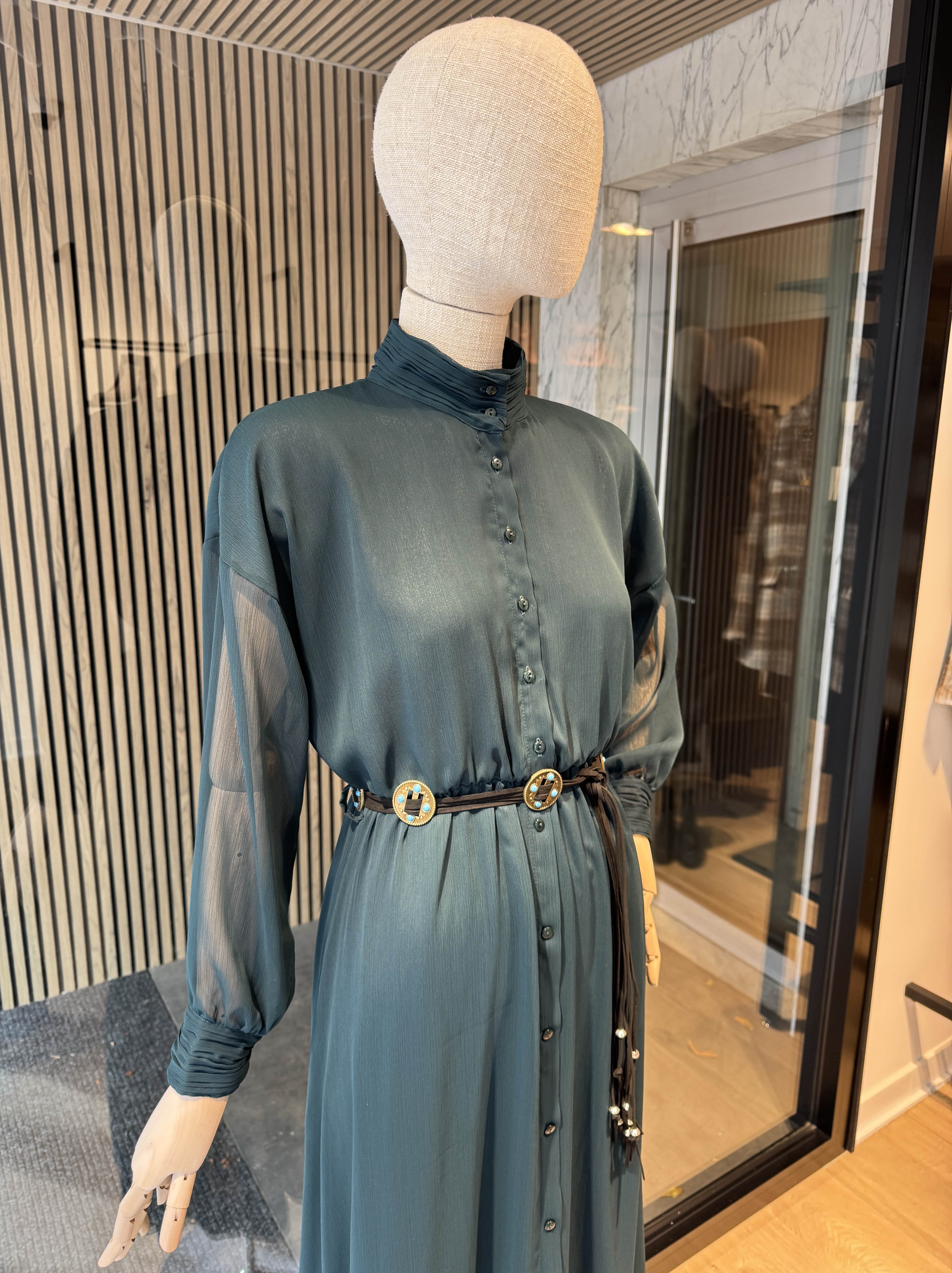 Long dark green dress with a belt