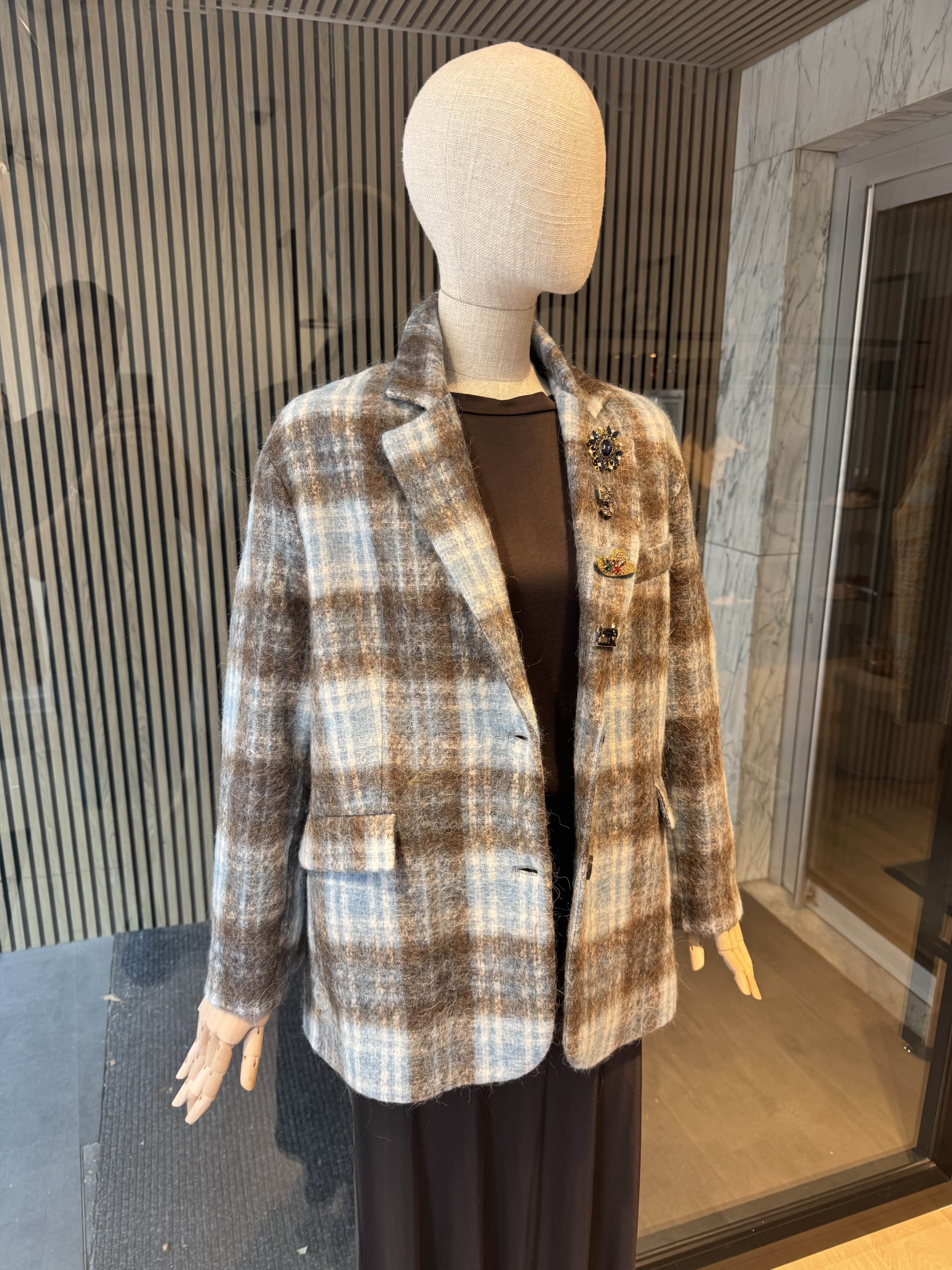 Pinstripe jacket with accessories on lapel