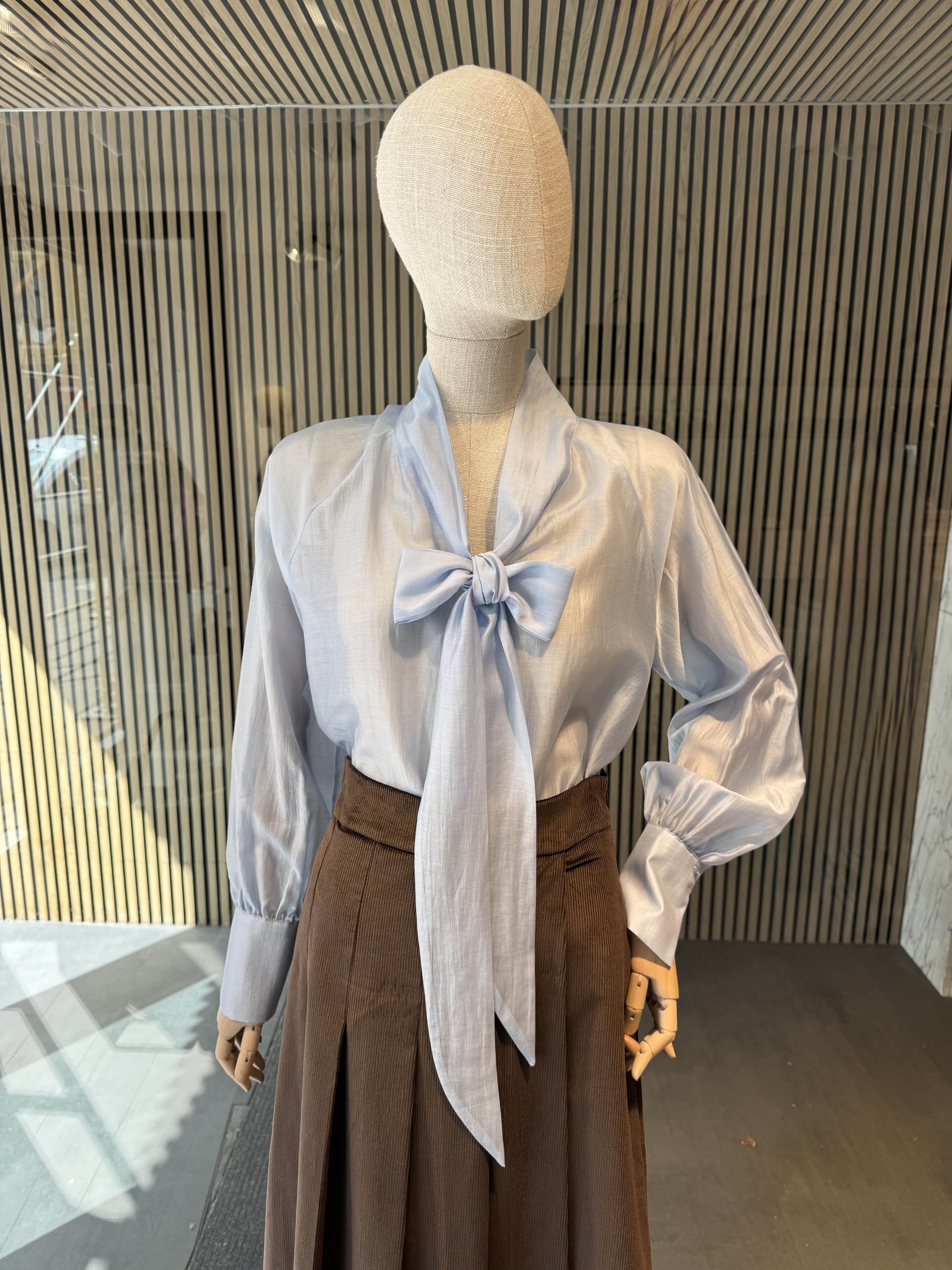Light blue bow blouse