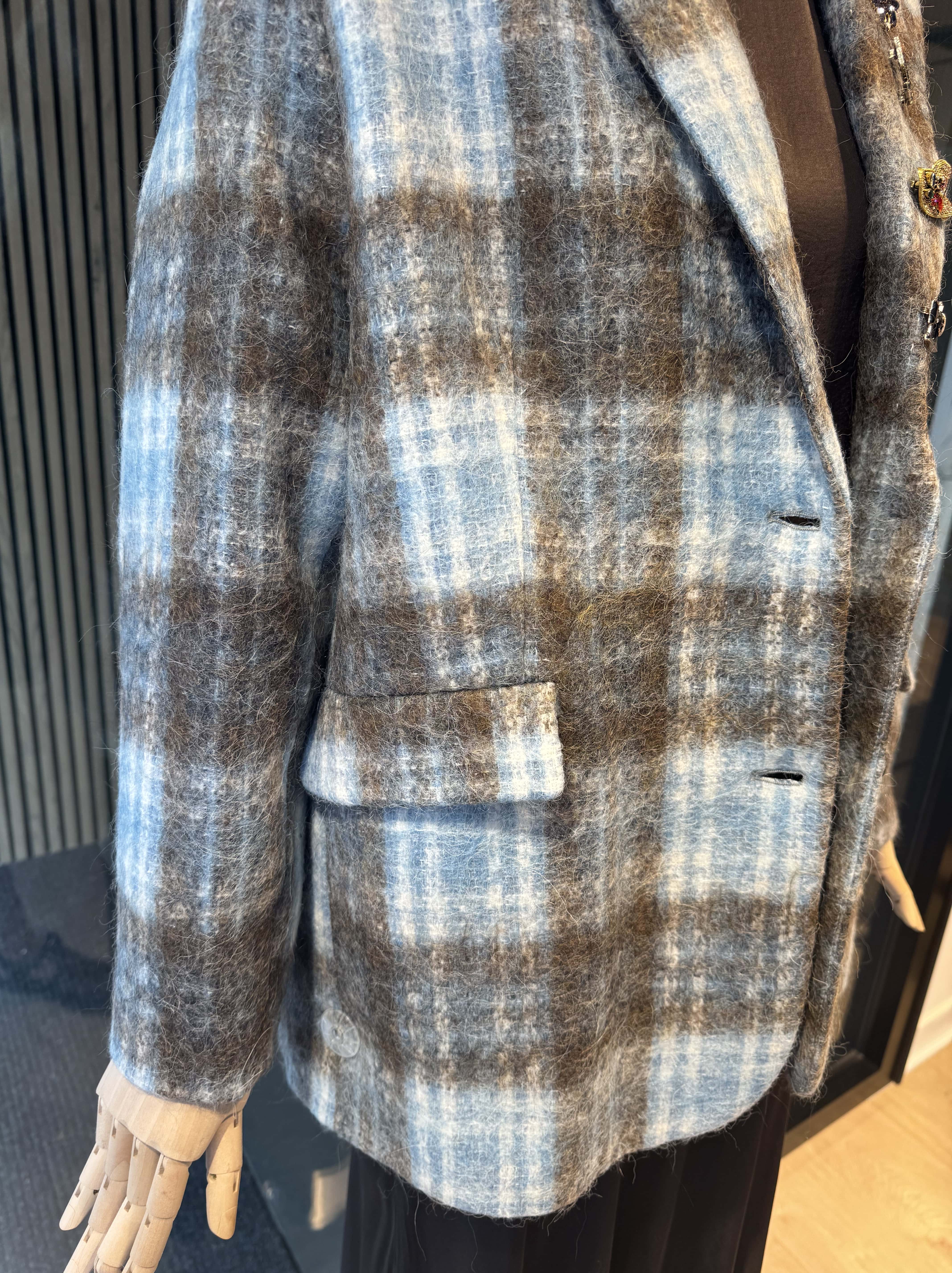 Pinstripe jacket with accessories on lapel