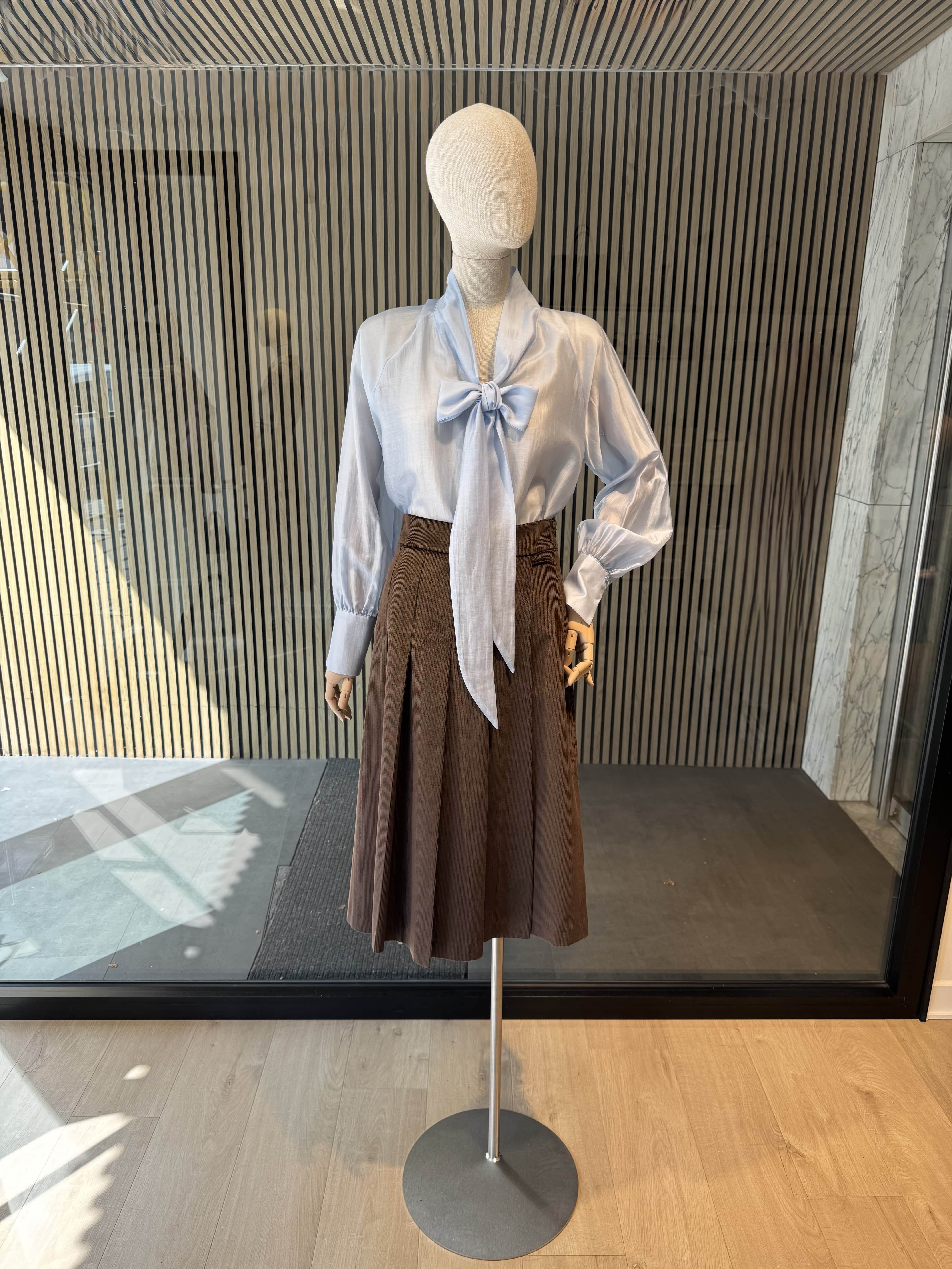 Light blue bow blouse