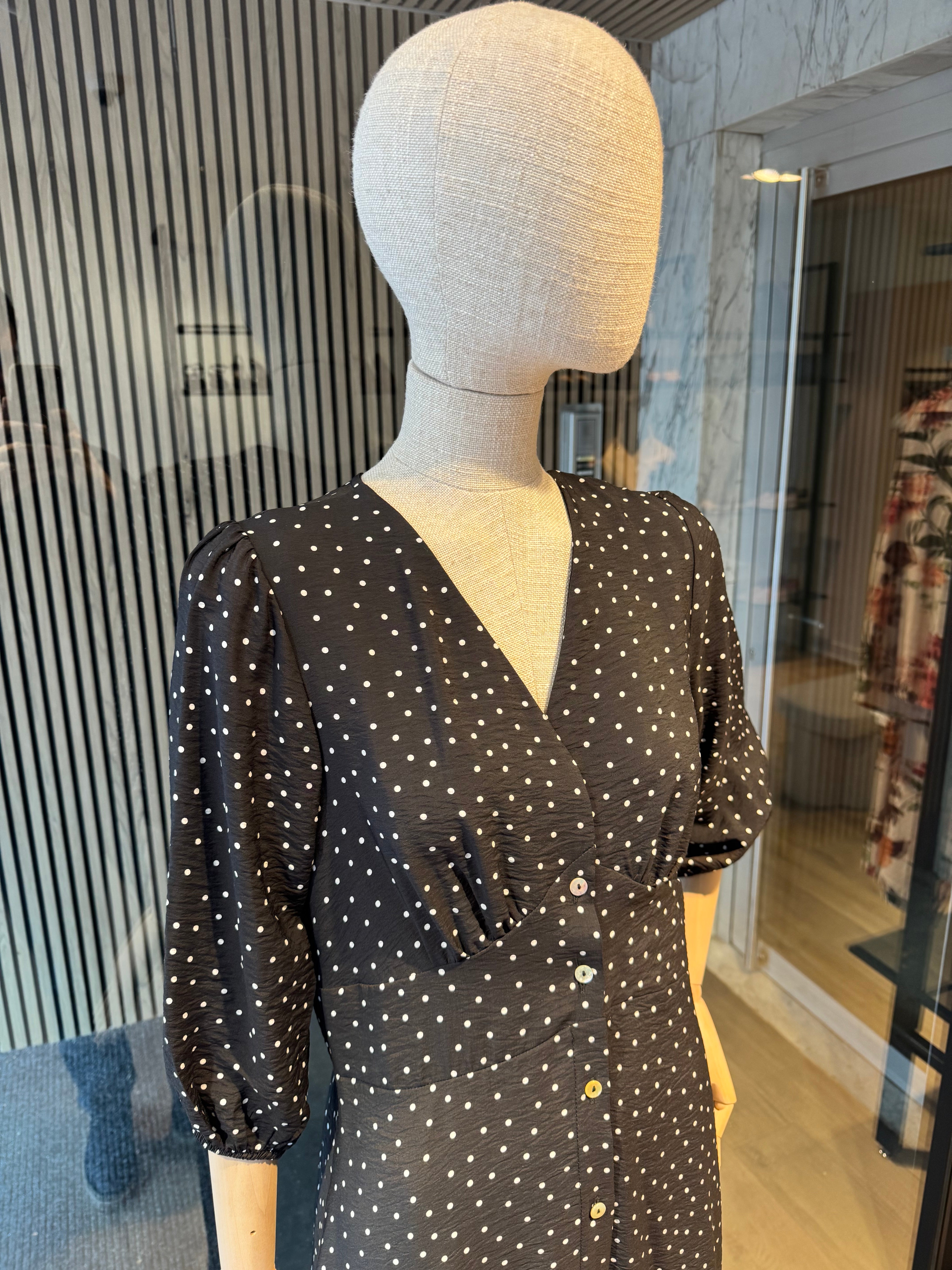 Black polka dot dress