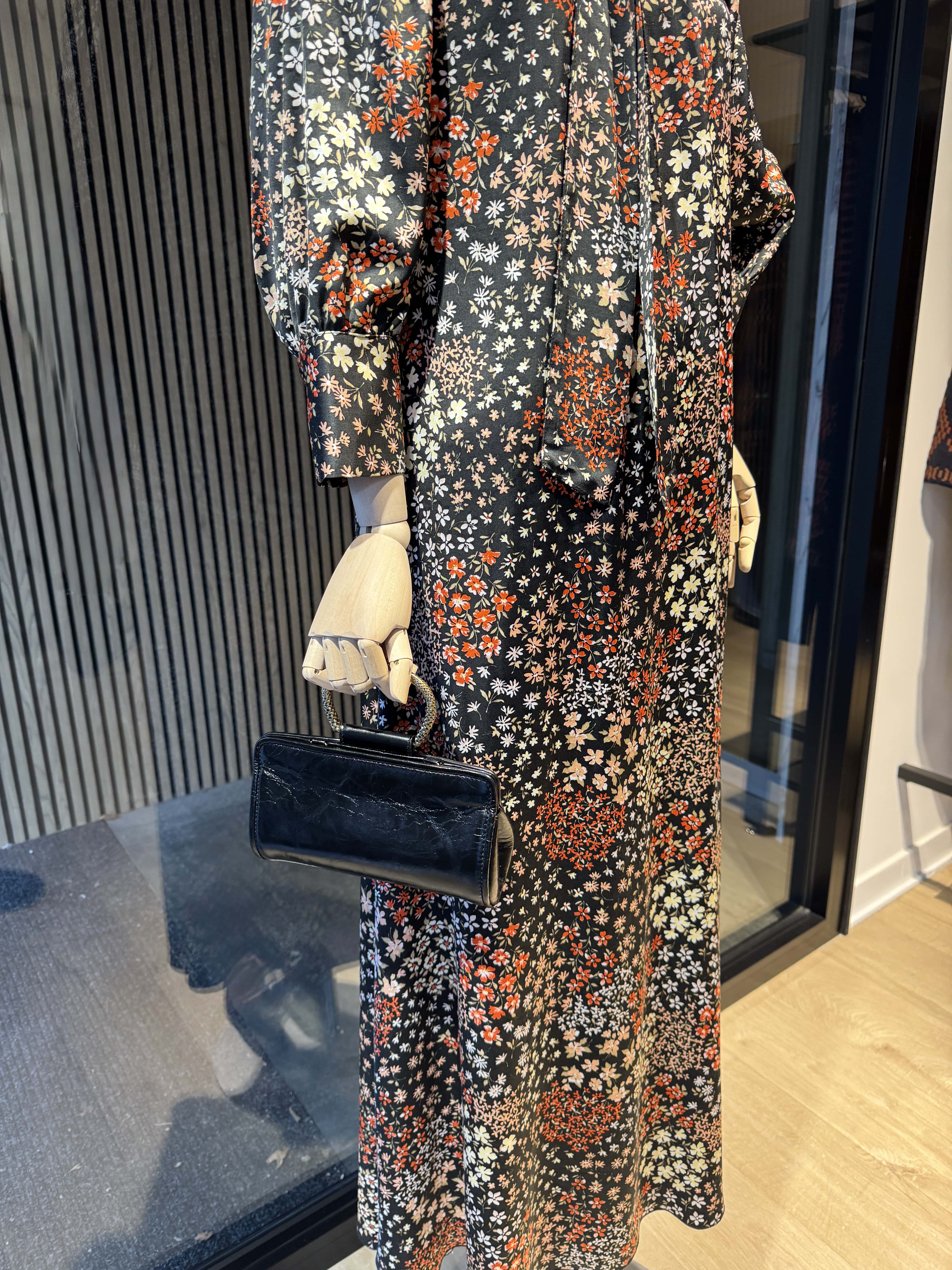 Long relaxed fit black dress with a floral print