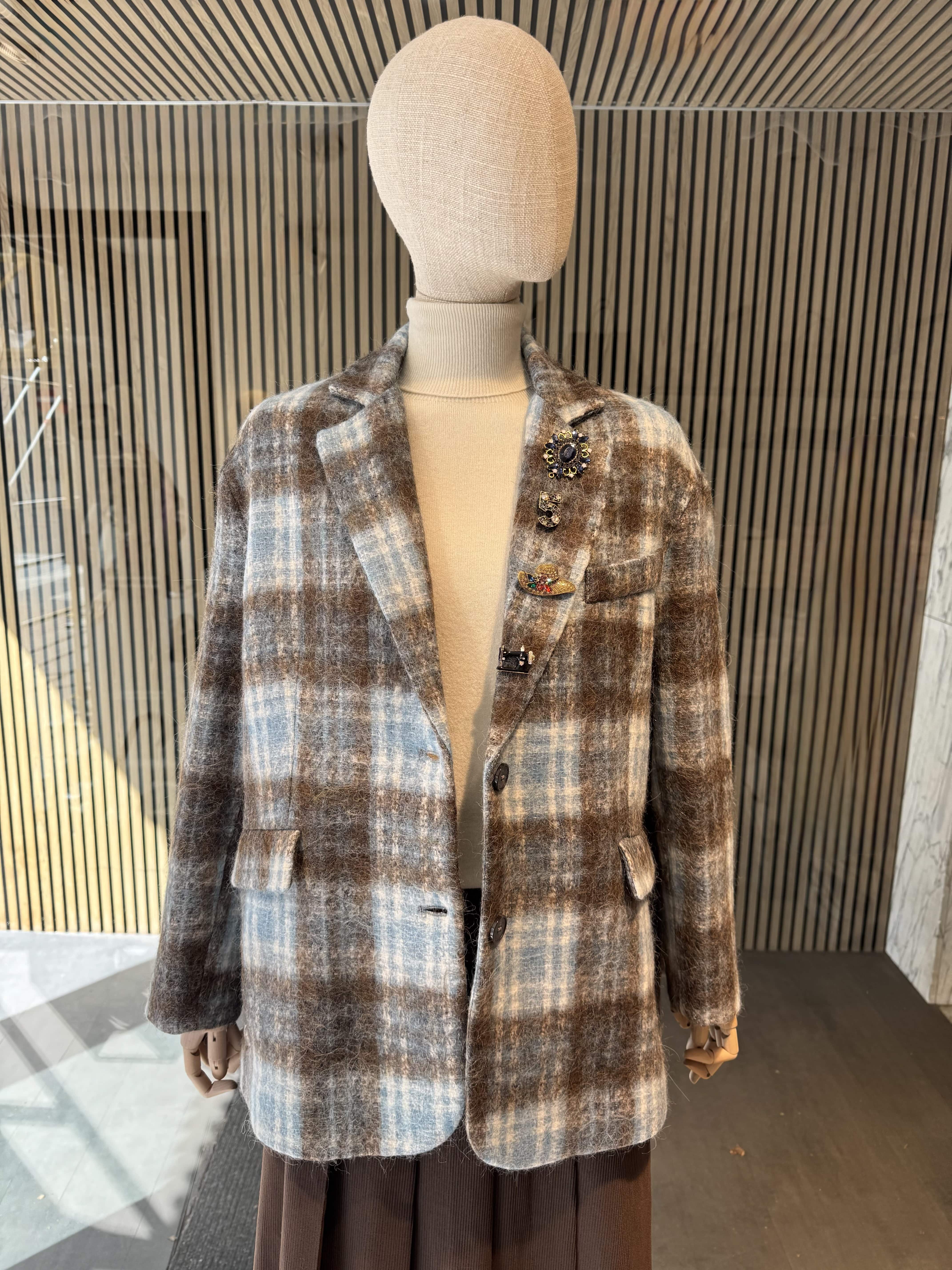 Pinstripe jacket with accessories on lapel