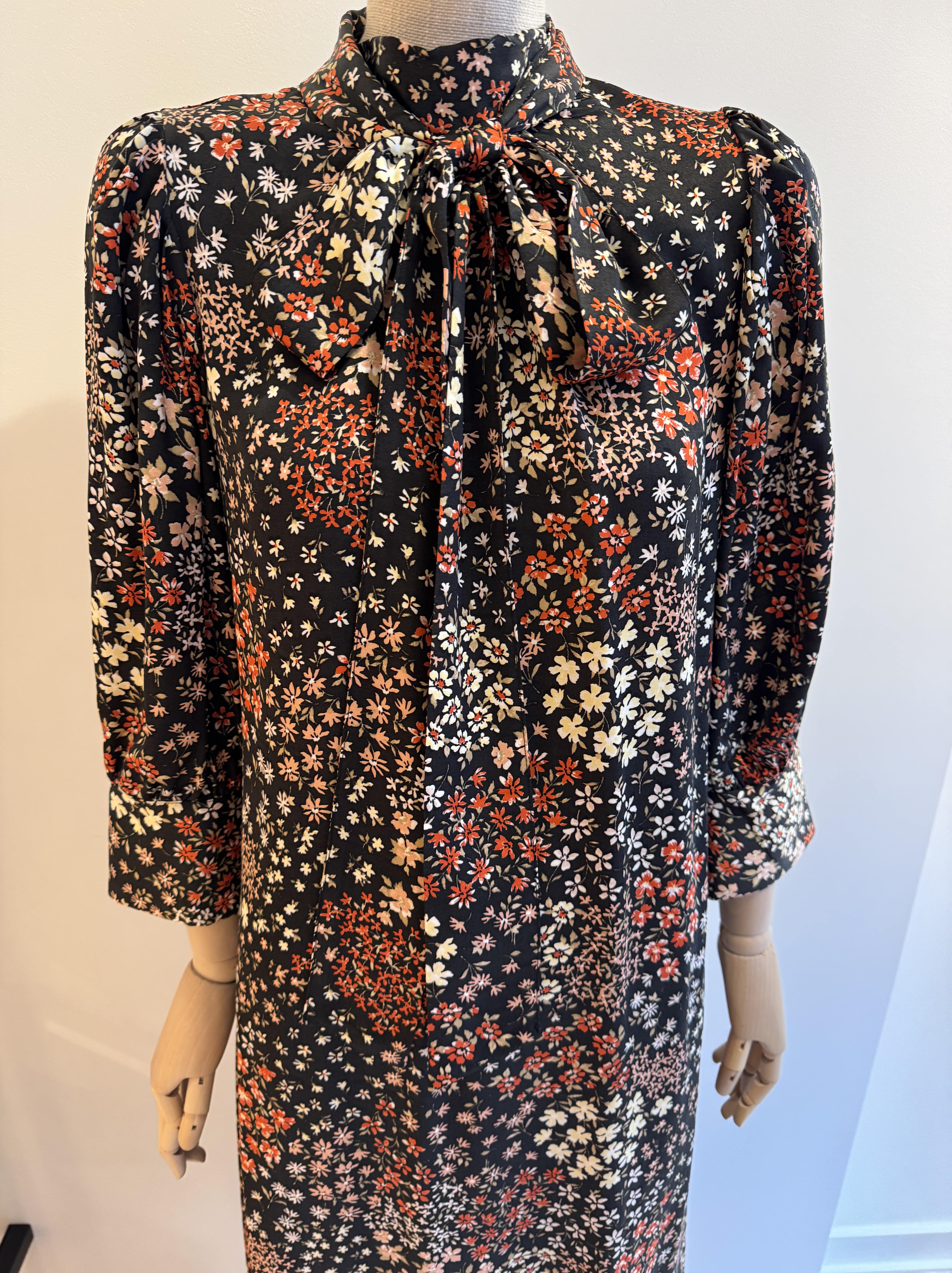 Long relaxed fit black dress with a floral print