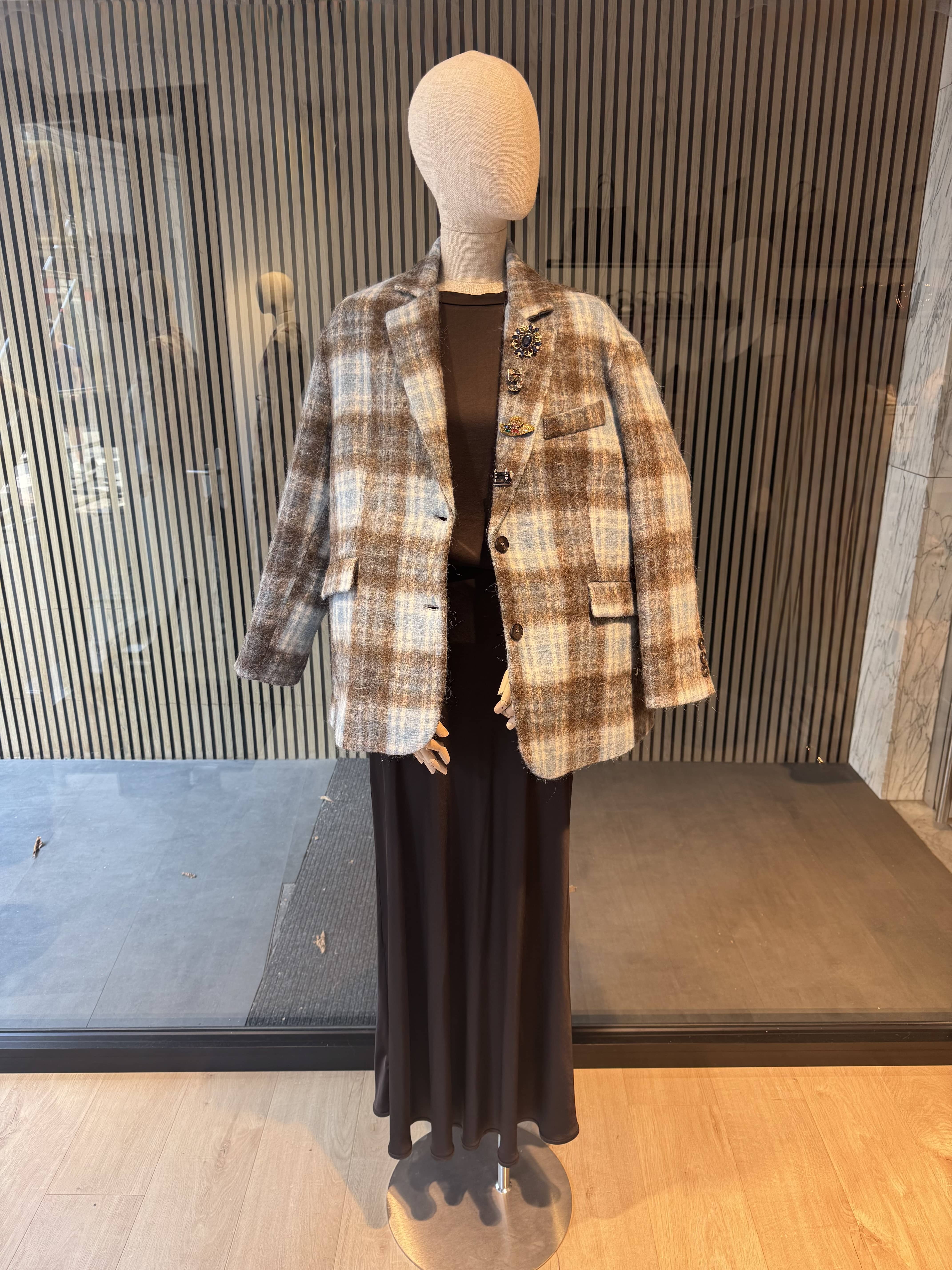 Pinstripe jacket with accessories on lapel