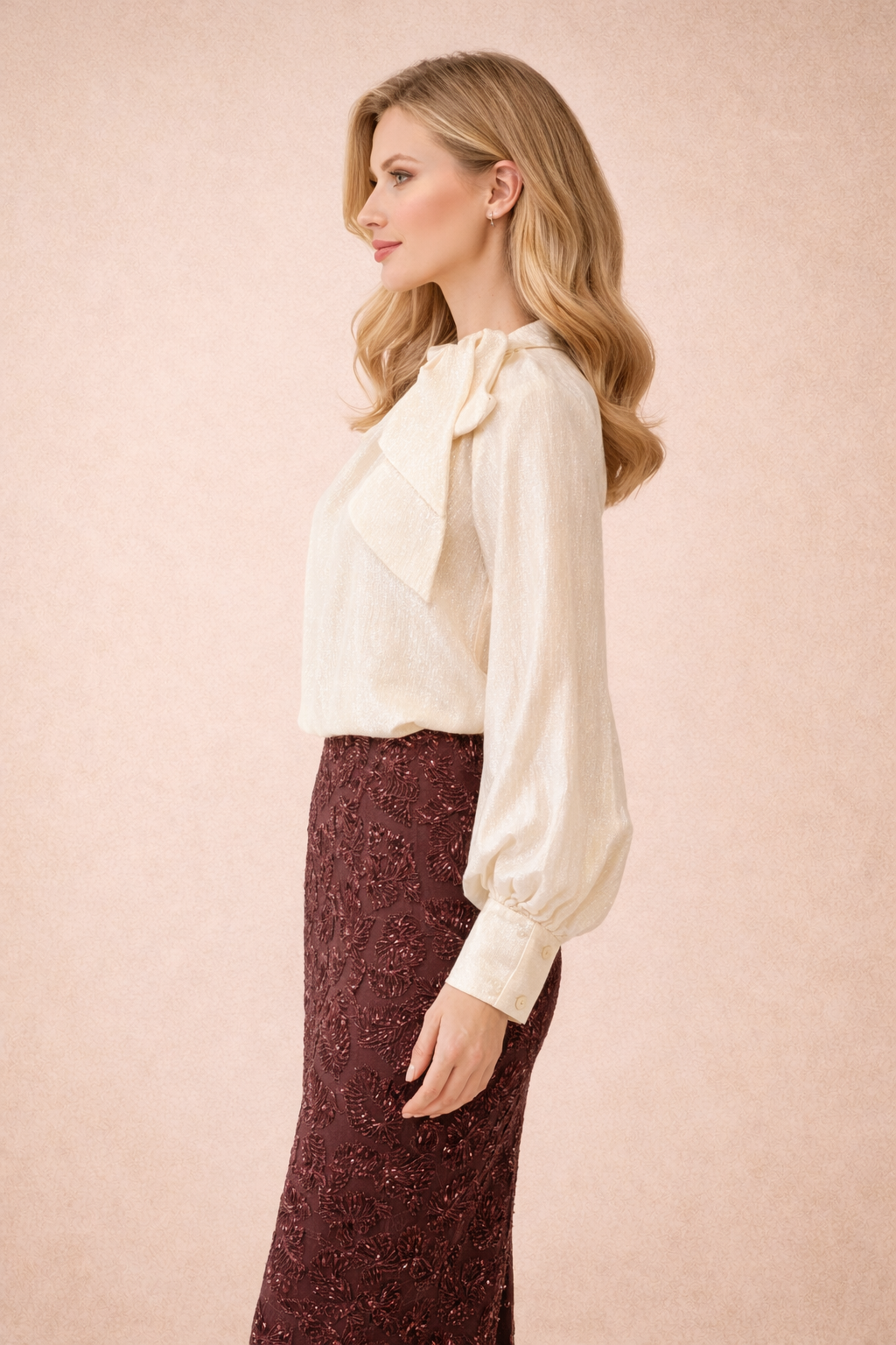 Relaxed fit cream blouse with a bow