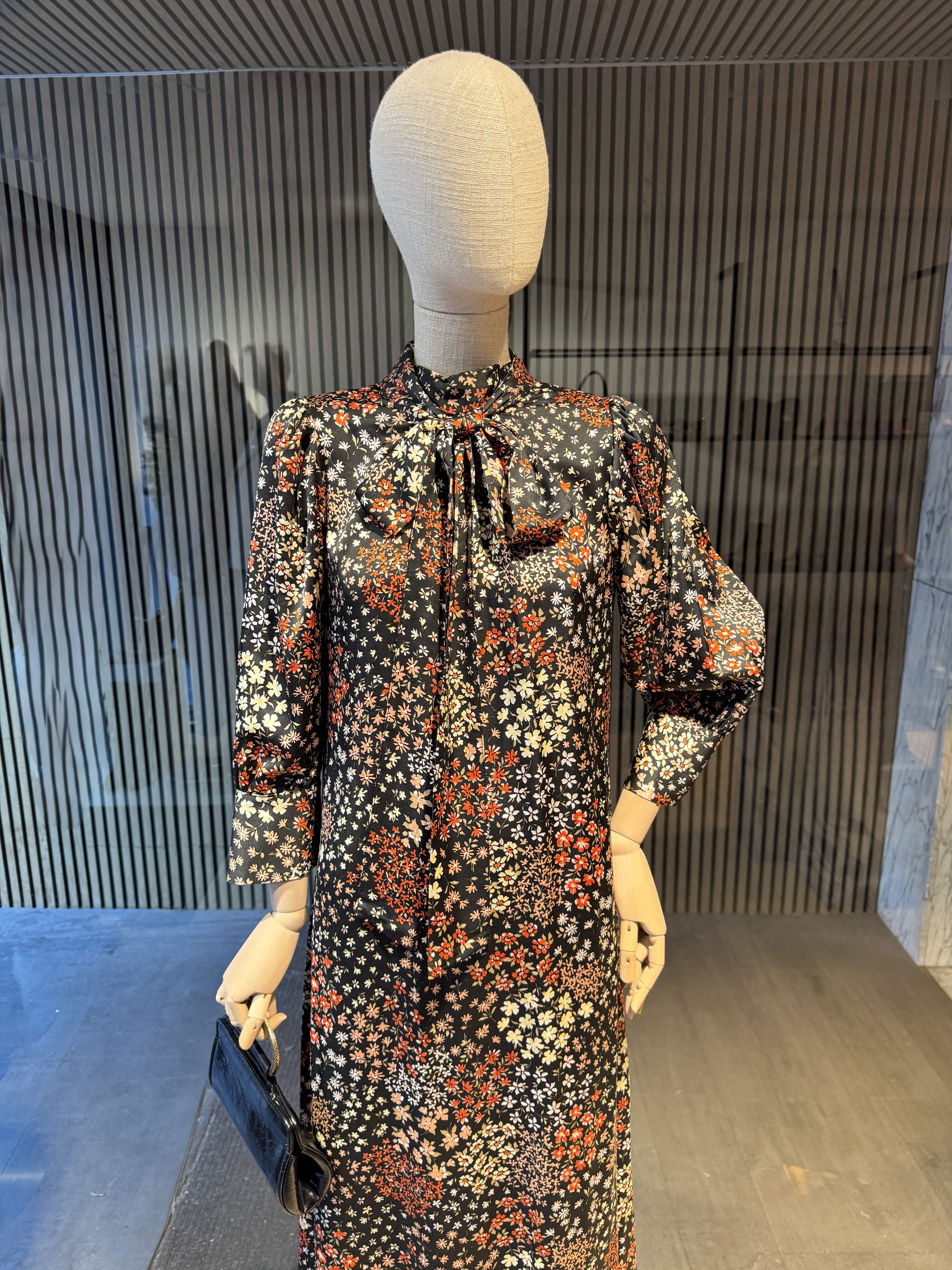 Long relaxed fit black dress with a floral print