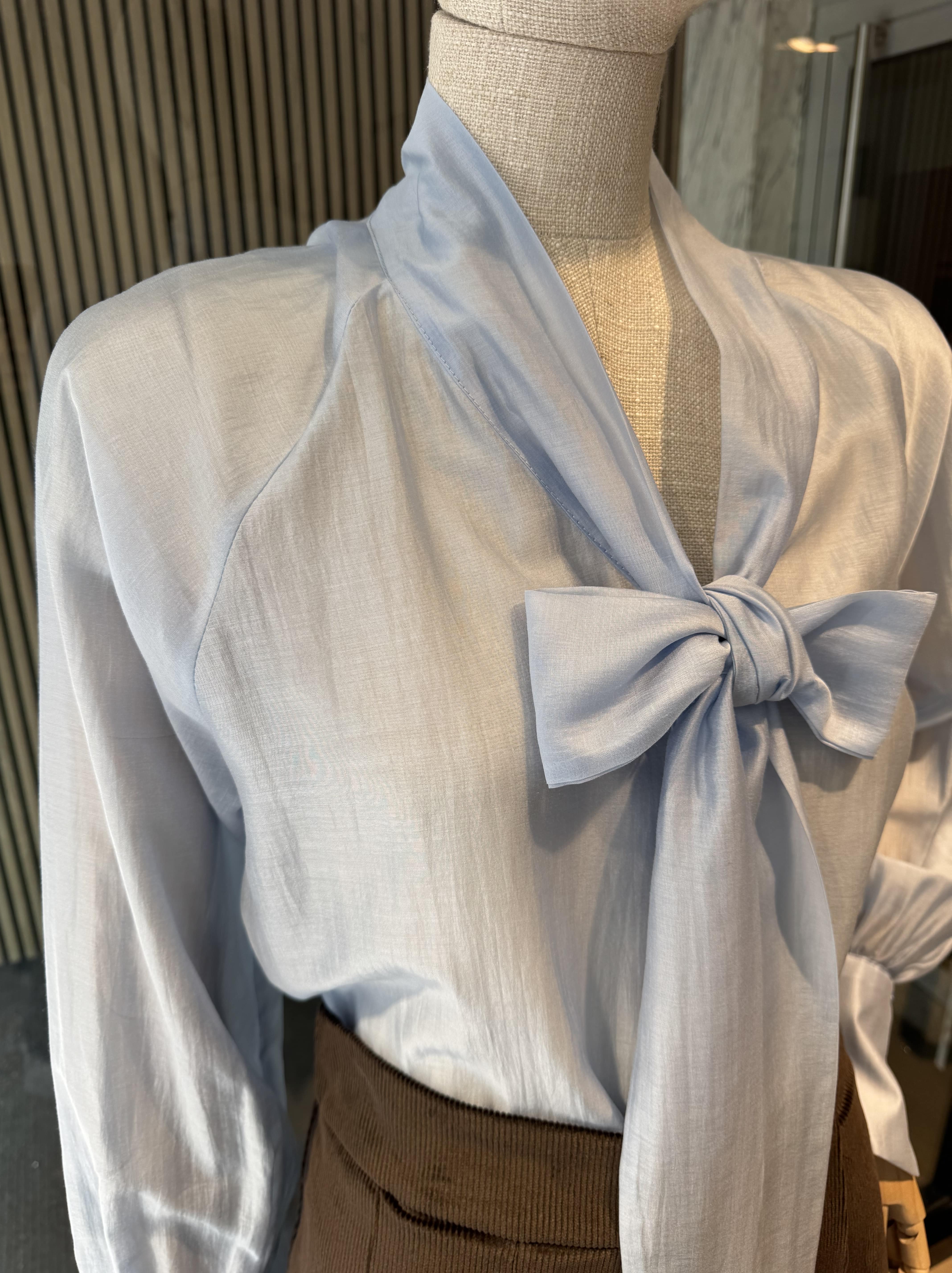 Light blue bow blouse