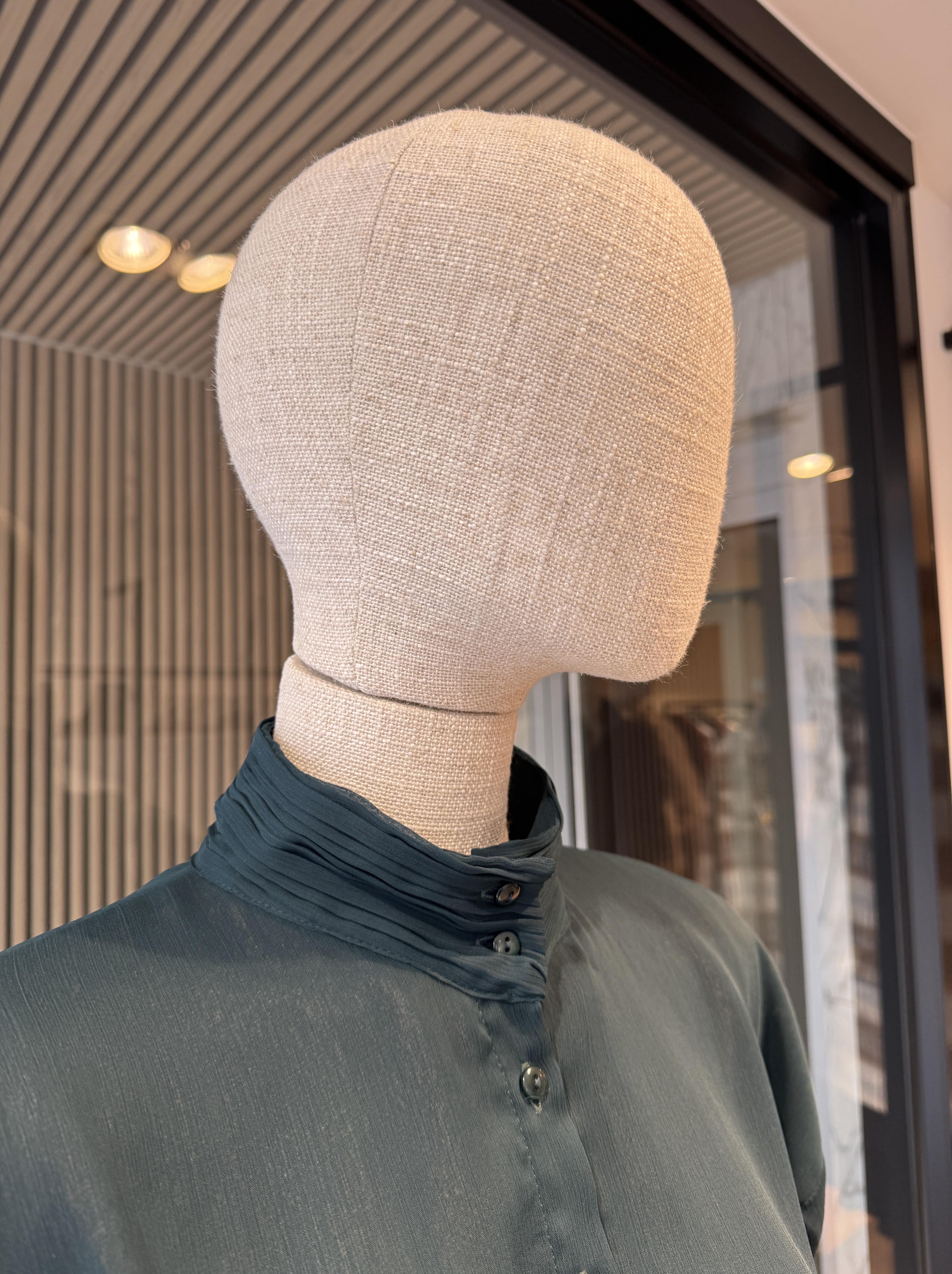 Long dark green dress with a belt