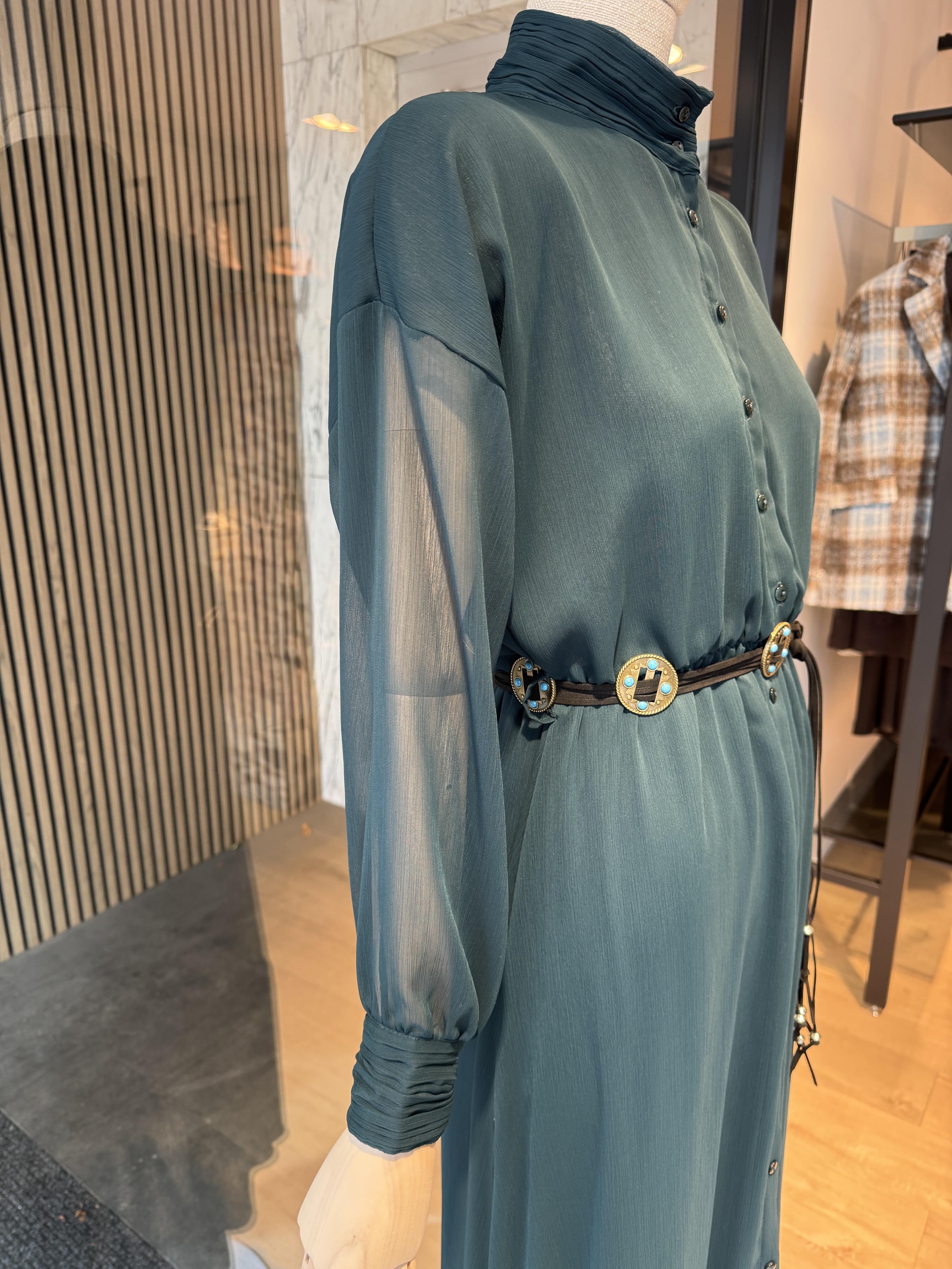 Long dark green dress with a belt