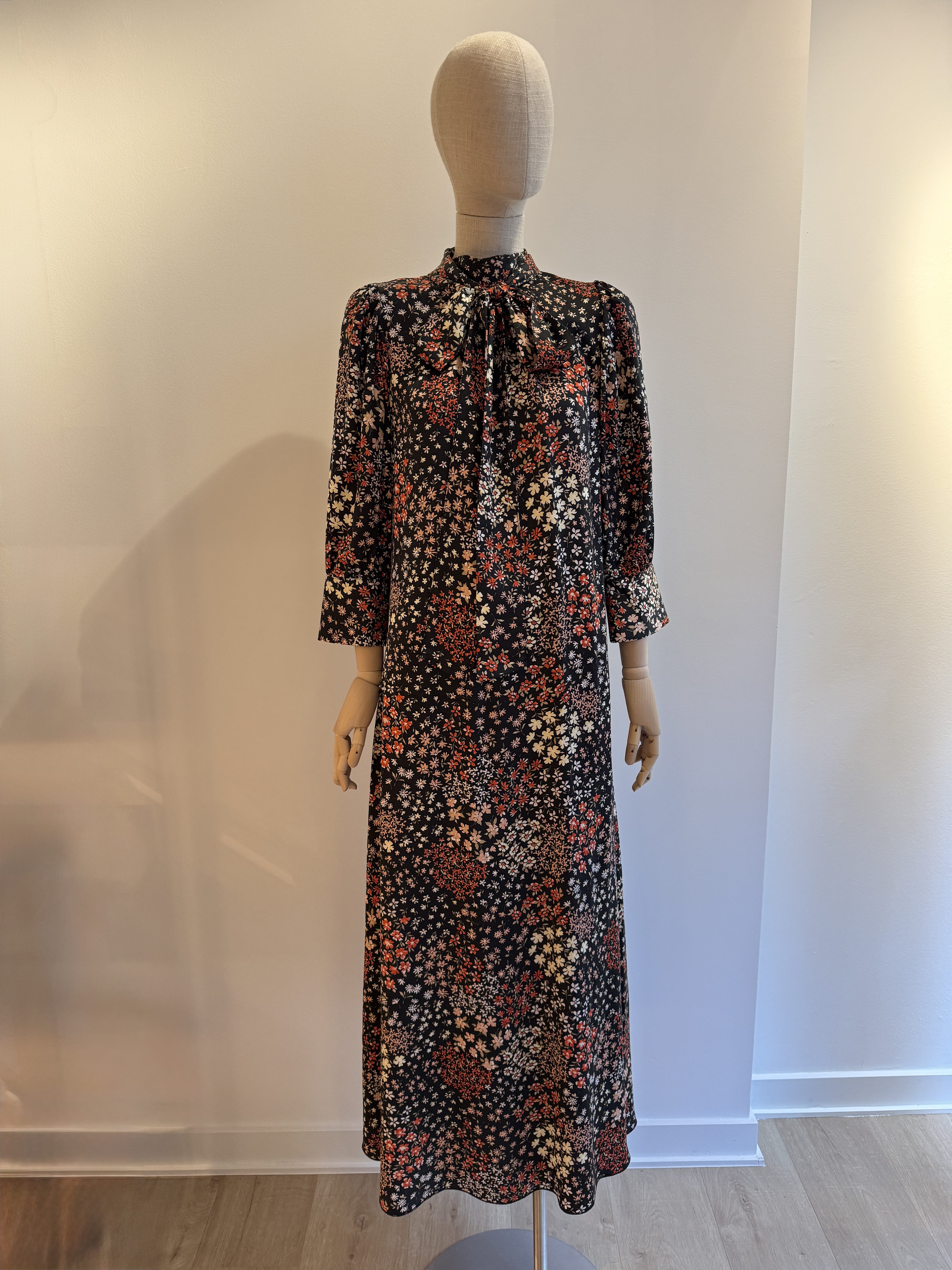 Long relaxed fit black dress with a floral print