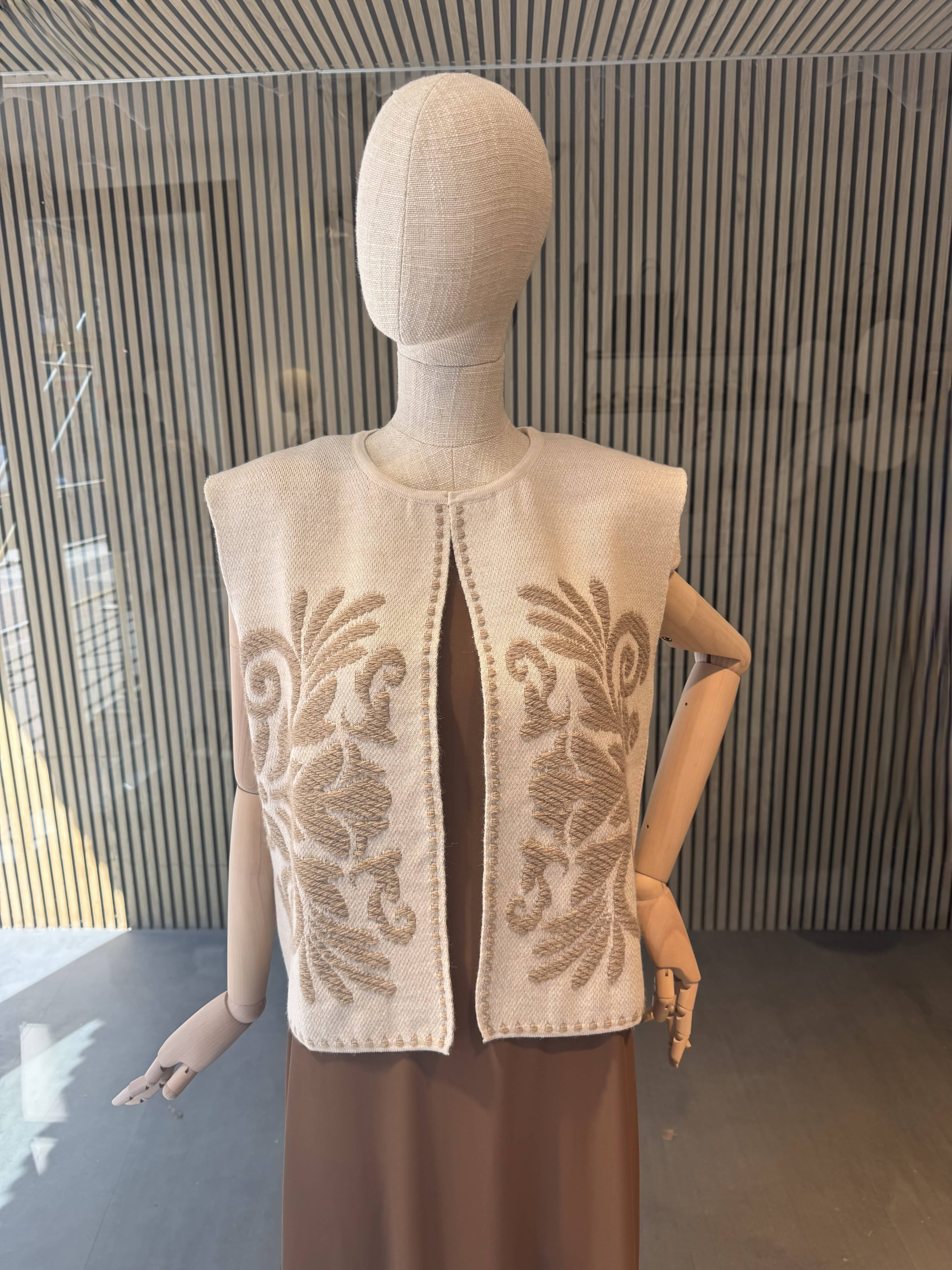 Vest with ornament