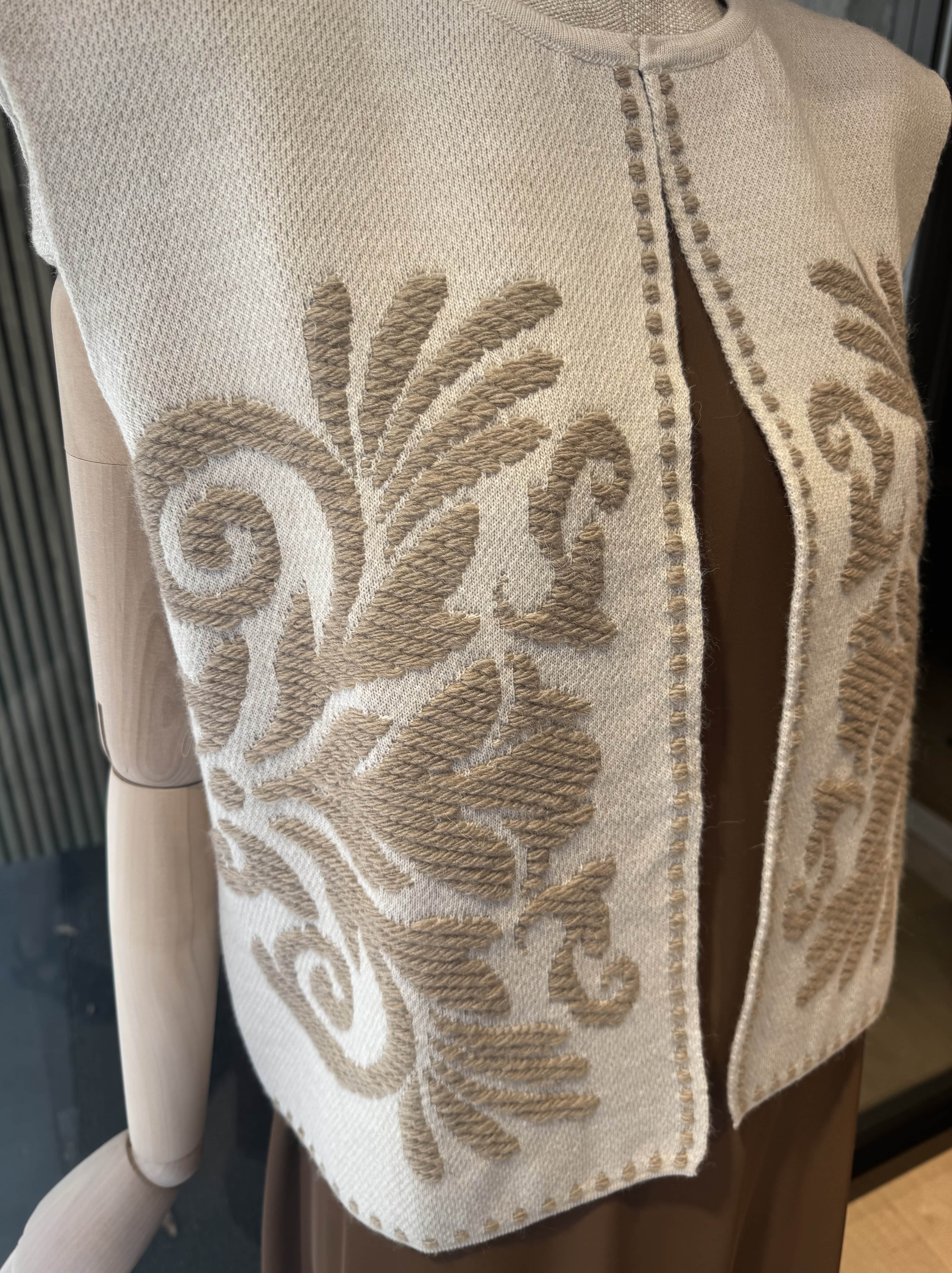 Vest with ornament
